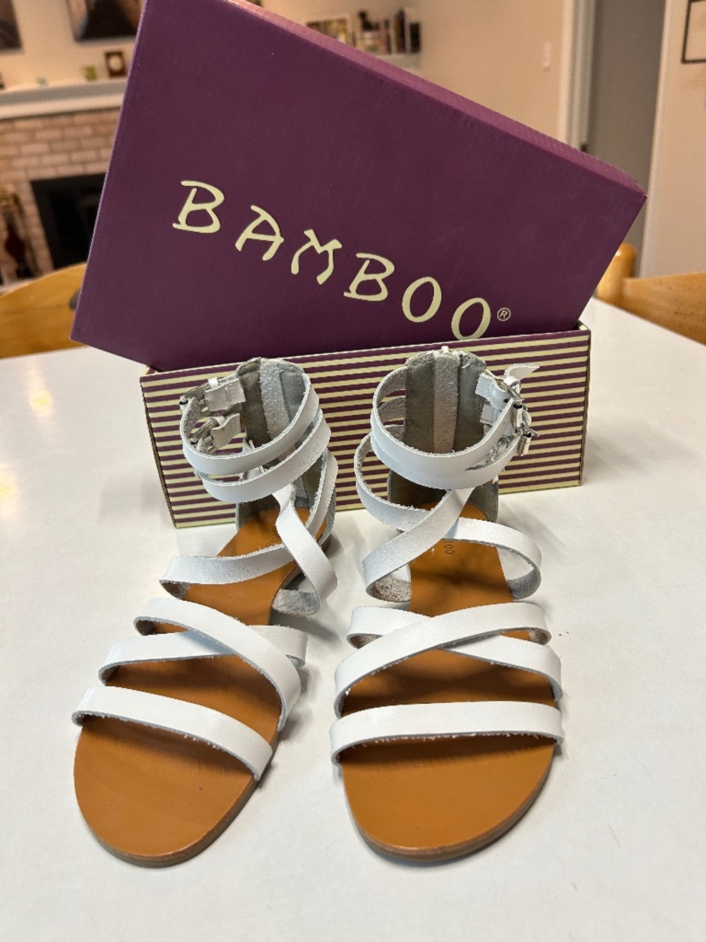 Pair of Bamboo brand white sandals